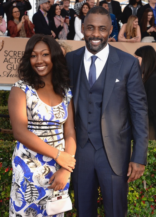 Idris Elba, with daughter Isan Elba, wearing a made-to-measure three-piece suit by Ermenegildo Zegna at the SAG Awards 2016